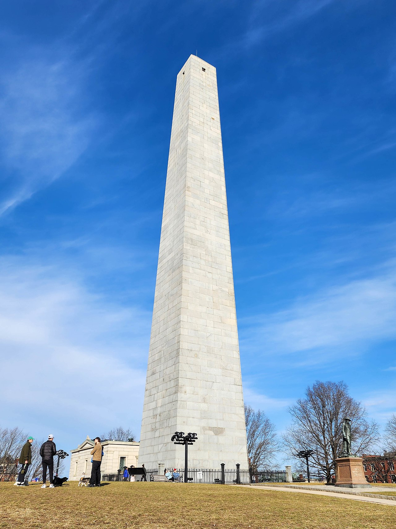 The tall granite obelisk of the Bunker Hill Monument standing over the Charlestown neighborhood.