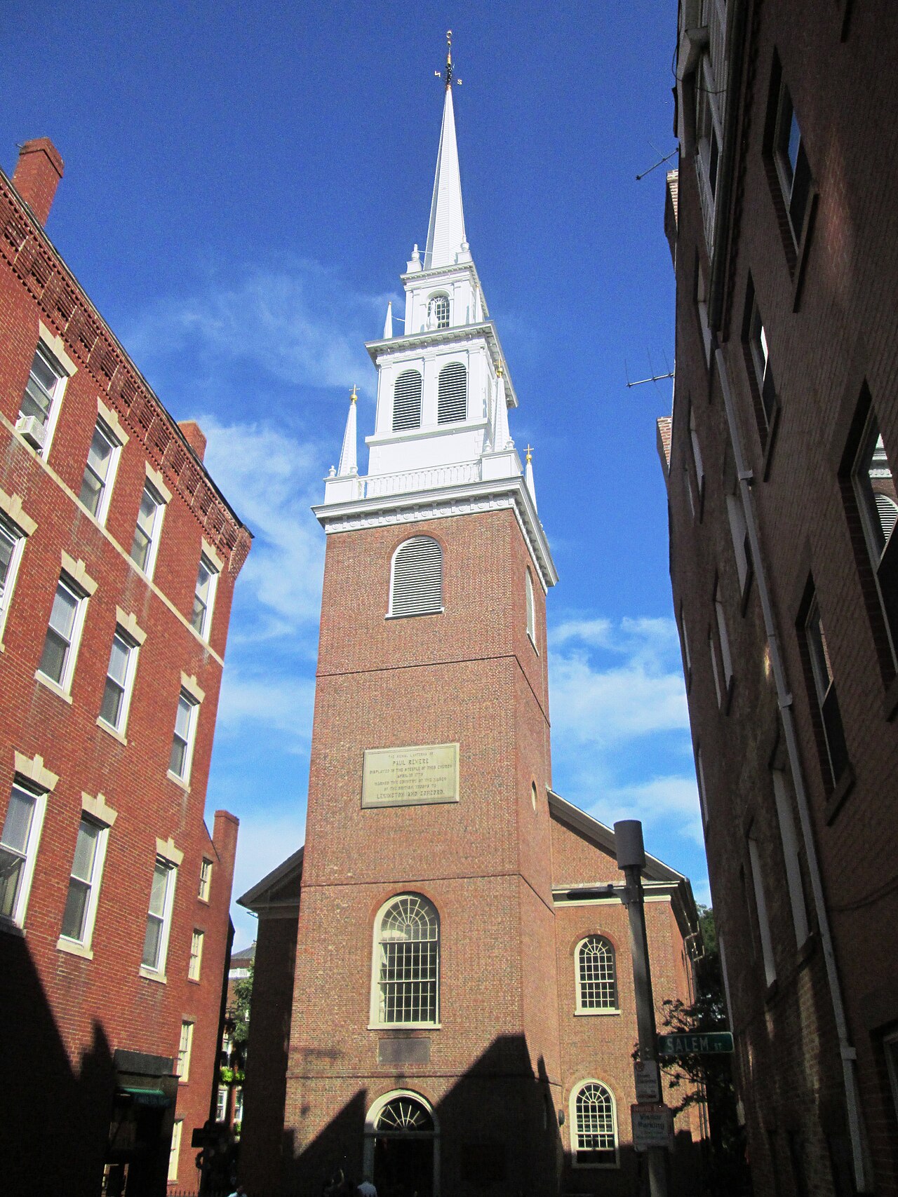 The white steeple of the Old North Church rising above brick rooftops in Boston's North End.